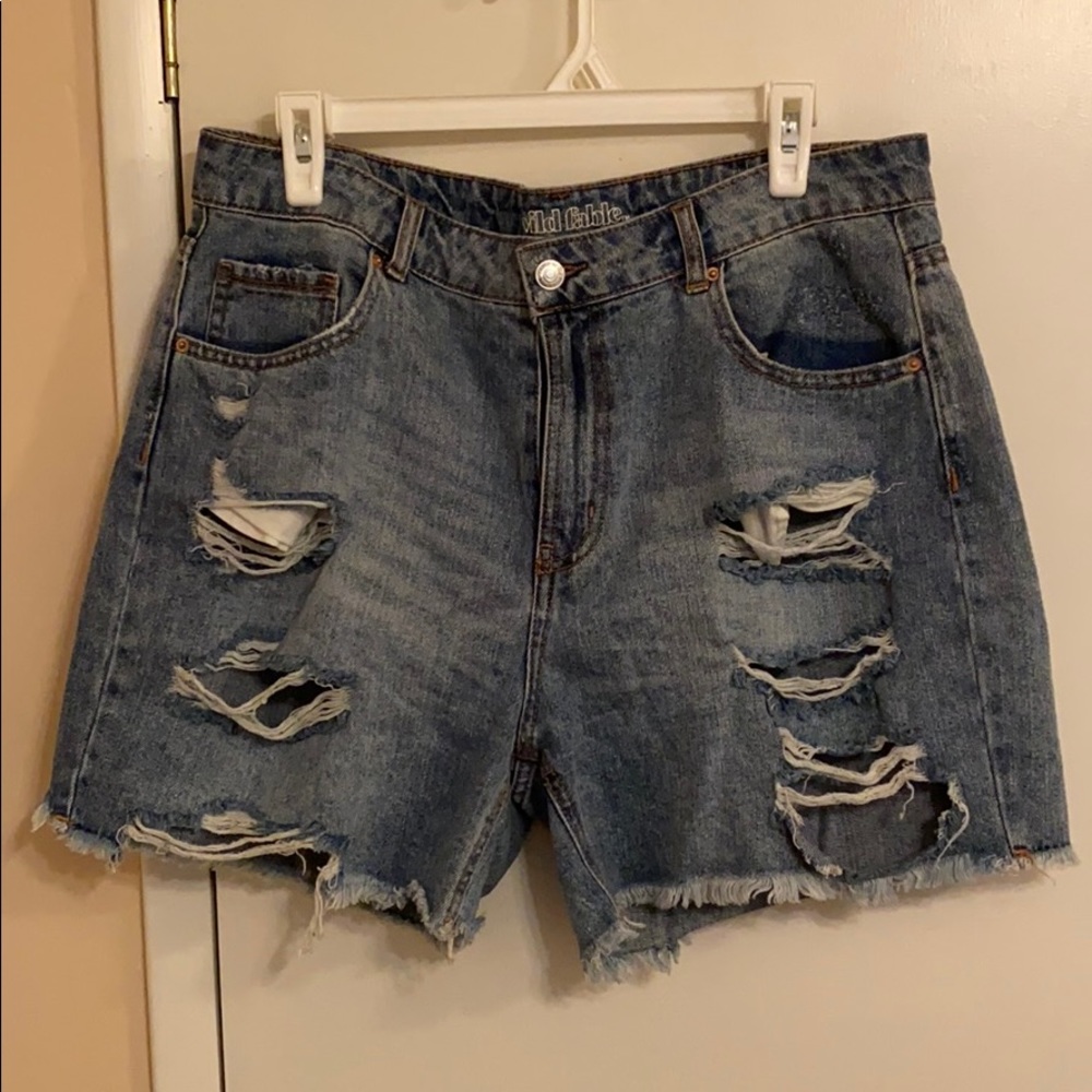 Torn jean shorts